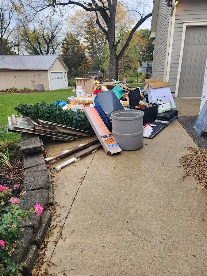 Dumpster being loaded with debris for Demolition Dumpster Rental in South Williamsport
